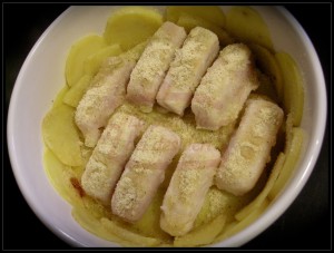 Filetti di nasello con sfoglie di patate