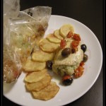 Involtino di branzino in carta fata con pomodorini ed olive taggiasche